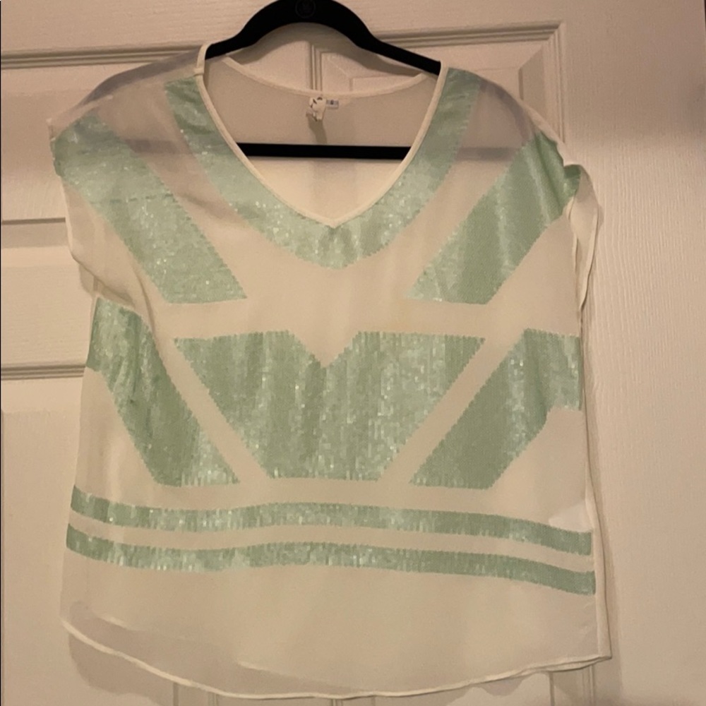 Women’s cream blouse with light green sequins